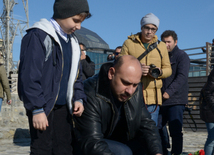 Baku residents bringing flowers to Seaside Boulevard to honor missing oil workers.  Azerbaijan, Dec.07, 2015